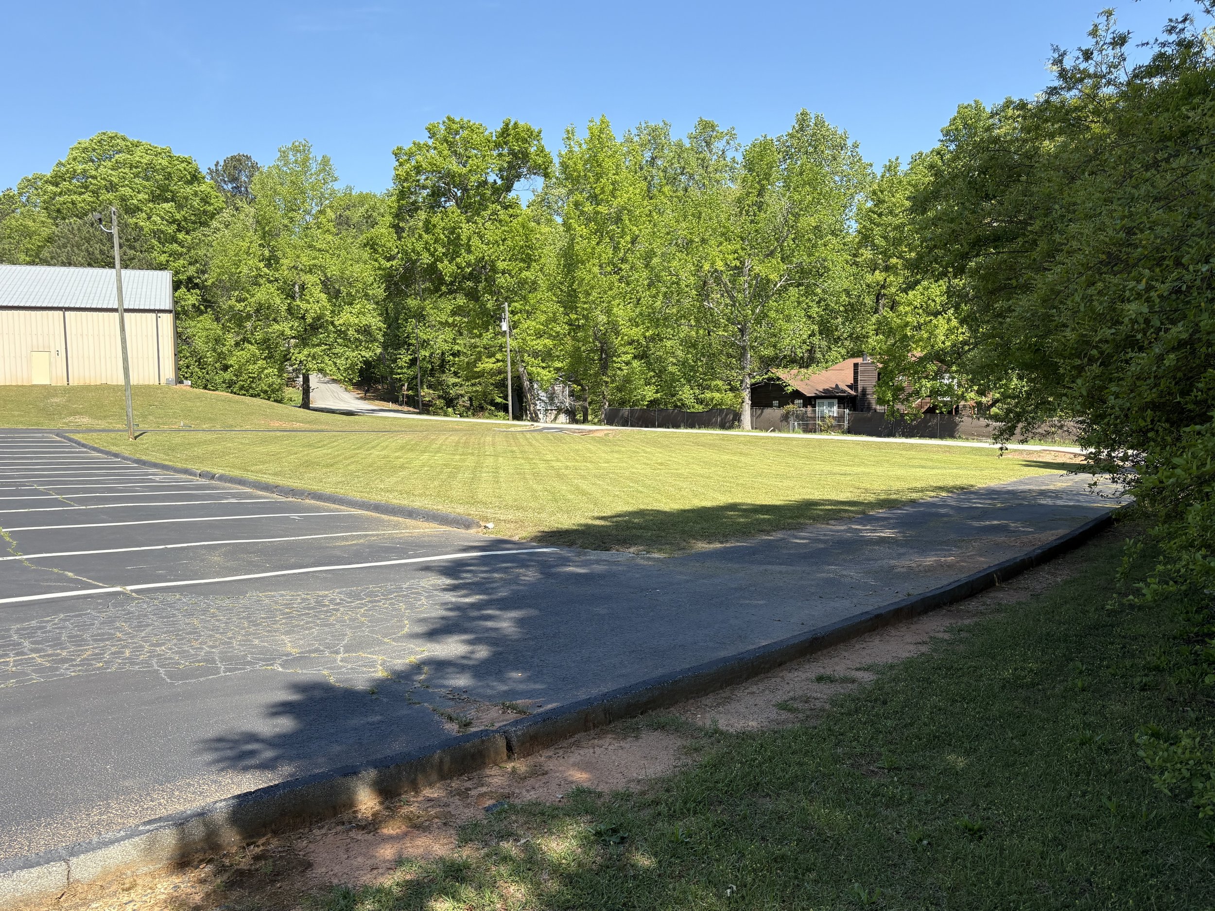 Hedgecoth Property Solutions team working on a landscaping project in Henry County, GA